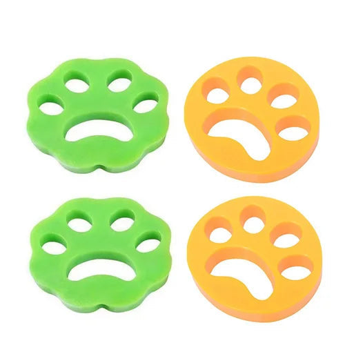 Four paw-shaped objects, two green and two orange, on a white background.